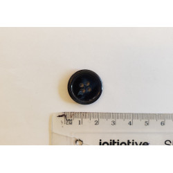 Large, navy color suit button with the ruler on a white background