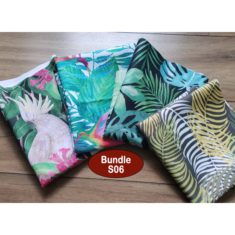 Outdoor fabric remnants bundle - jungle patterns, placed on a wooden background