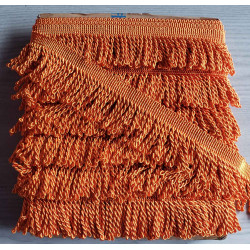 Thick bullion fringe - 60mm - orange color, full reel of the fringing placed on a grey background