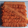 Thick bullion fringe - 60mm - orange color, full reel of the fringing placed on a grey background