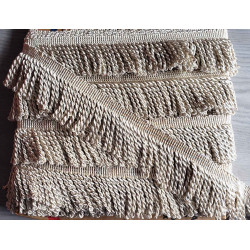 Thick bullion fringe - 60mm - beige color, full reel of the fringing placed on a grey background