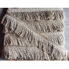 Thick bullion fringe - 60mm - beige color, full reel of the fringing placed on a grey background