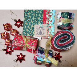 Layer Cake - Christmas metallic fabric bundle, placed on a natural background with some Christmas decorations gathered around