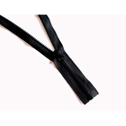 chunky plastic - open- end -zip-  black,  30cm long, placed on a white background across the frame