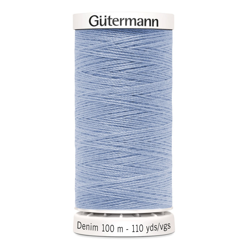 Sewing machine thread - light blue color - 200m spool, placed on a white background Sewing machine thread - light blue color - 200m spool, placed on a white background