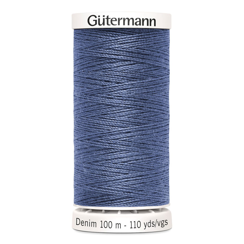 Sewing machine thread - Denim blue color - 200m spool, placed on a white background Sewing machine thread - Denim blue color - 200m spool, placed on a white background