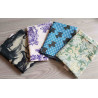 Outdoor fabric remnants bundle - mix of patterns, placed on a wood background