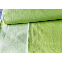 heavy stretch denim fabric  - lime, the fabric placed on the table with a fold