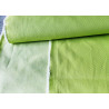 heavy stretch denim fabric  - lime, the fabric placed on the table with a fold