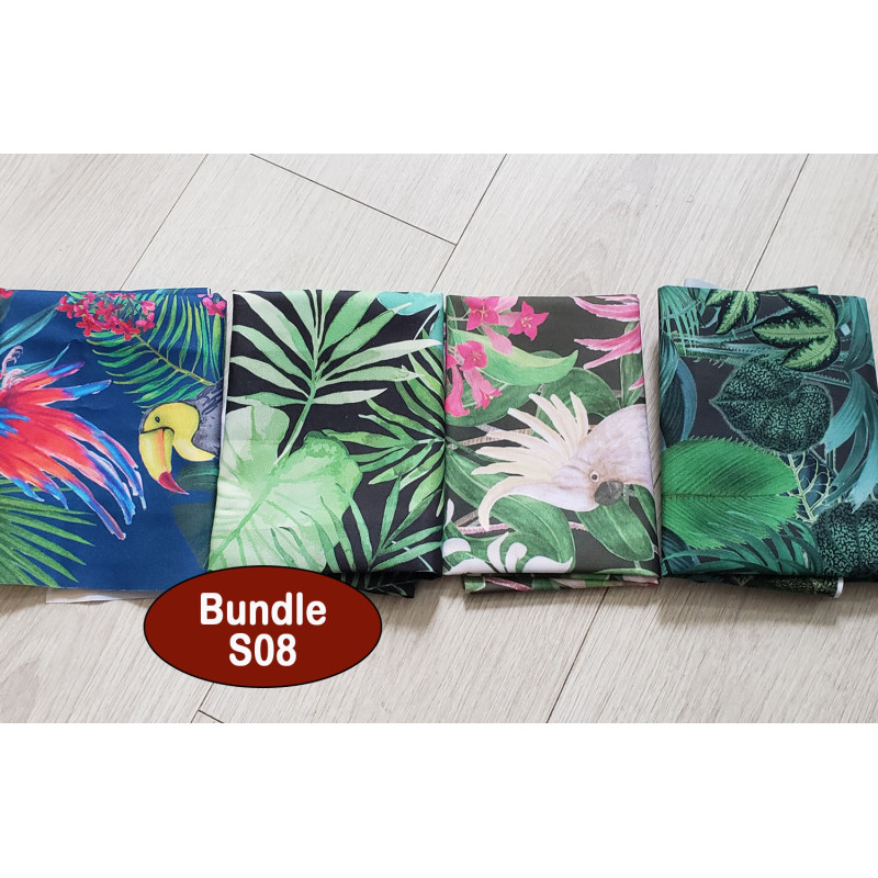 Outdoor fabric remnants bundle - tropical patterns- 4 pieces, placed on a white, wooden background Outdoor fabric remnants bundle - tropical patterns- 4 pieces, placed on a white, wooden background