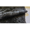 Short pile fur fabric in black color, the fabric is placed with the fold across the frame