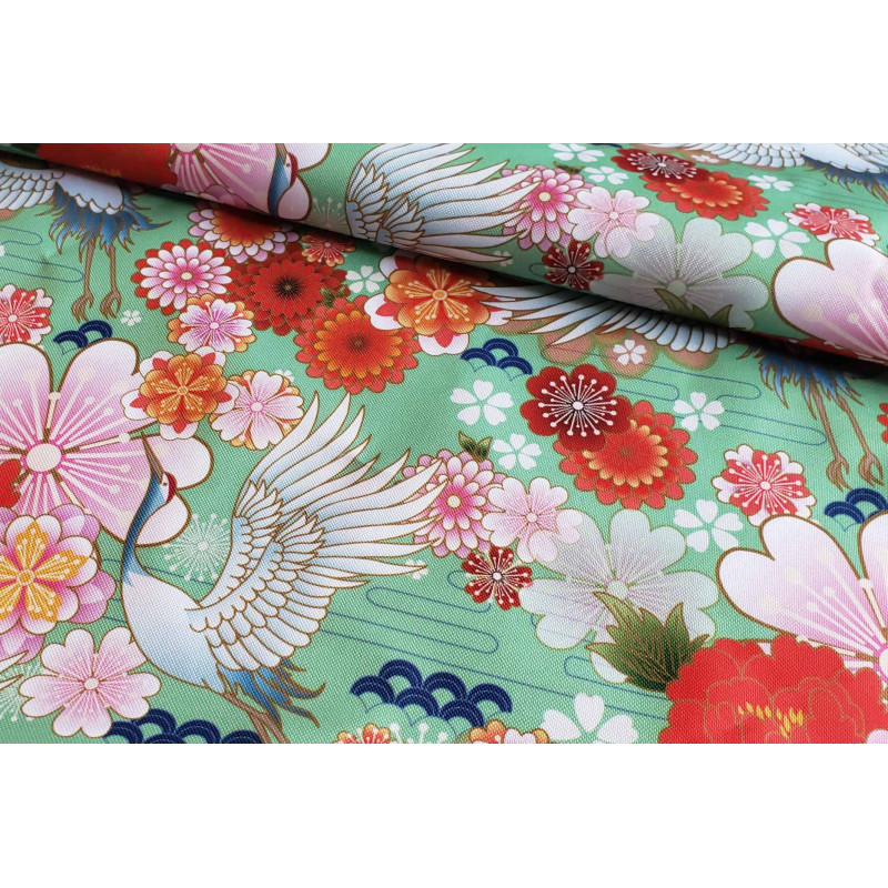 Waterproof Fabric - Cranes and flowers on light green, the capture with the fold Waterproof Fabric - Cranes and flowers on light green, the capture with the fold