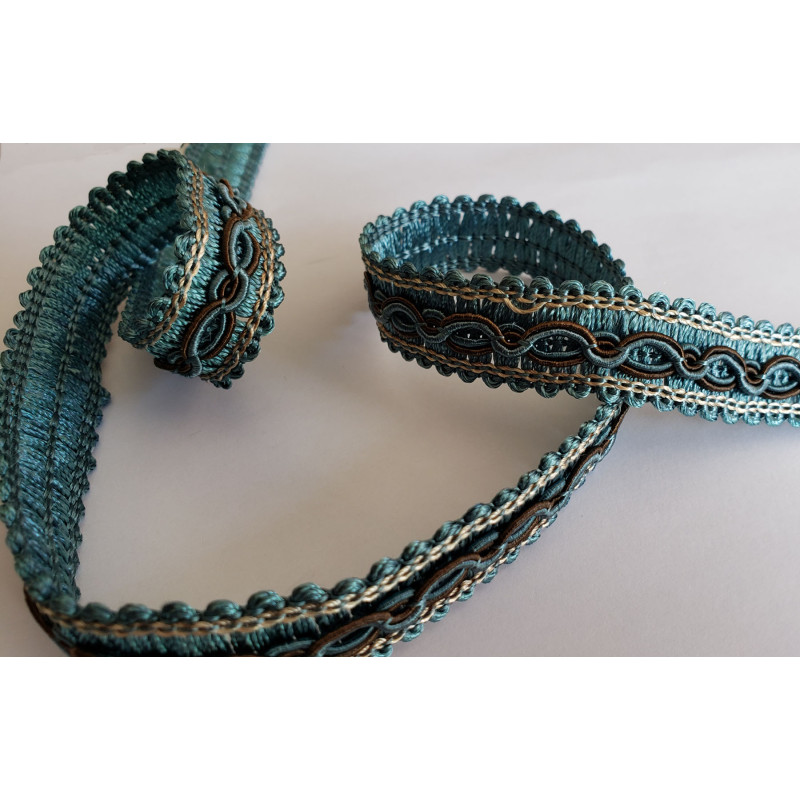 Multicolor gimp trim 16mm - teal-brown-beige, twisted on a white background Multicolor gimp trim 16mm - teal-brown-beige, twisted on a white background
