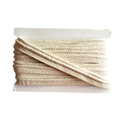 Insertion cord in ecru color with braided cord look, full reel, close-up capture on the white background