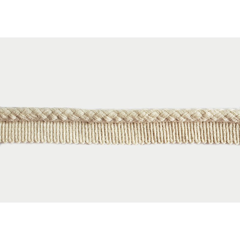 Insertion cord in ecru color with braided cord look, close-up capture on the white background Insertion cord in ecru color with braided cord look, close-up capture on the white background