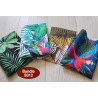 Outdoor fabric remnants bundle - tropical designs, four pieces of fabric placed on a white wooden background