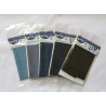 set of denim fabric sheets placed on a white background