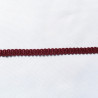 Upholstery braid 14mm - Burgundy color, a strip of the gimp placed on a white background