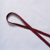 Upholstery braid 14mm - Burgundy color, a loop shape placed on a white background