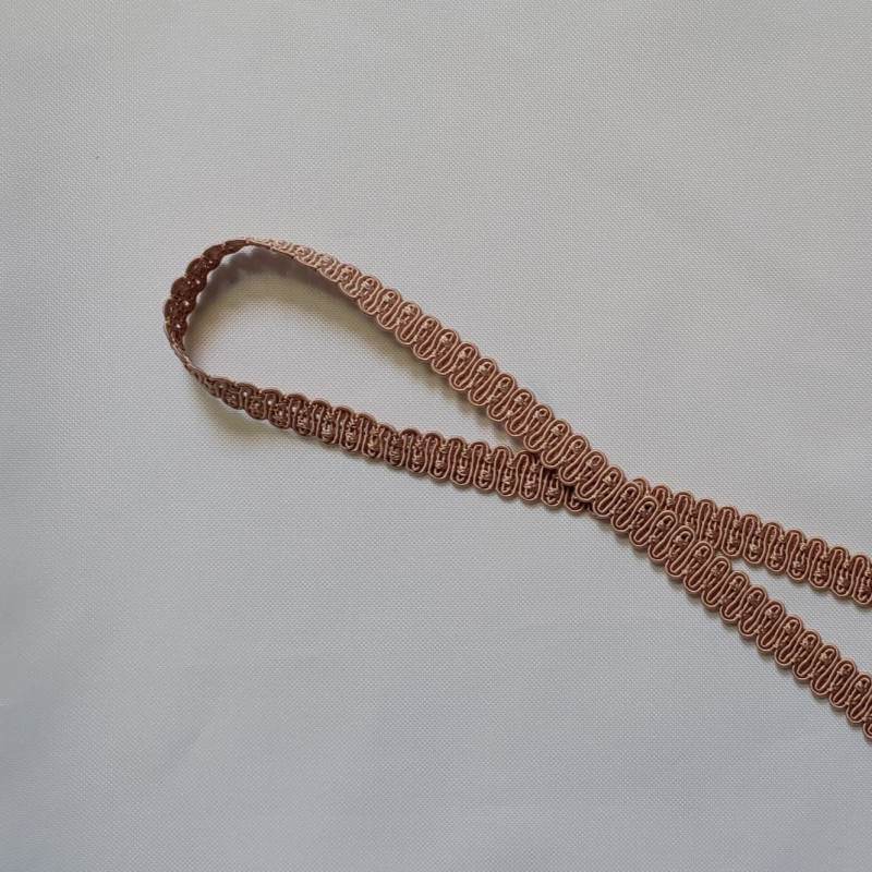Upholstery braid 14mm - light brown color, a loop shape placed on a white background