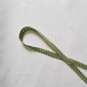 Upholstery braid 14mm - light Green color, a loop shape placed on a white background