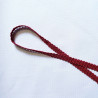Upholstery braid 14mm - Rose color, a loop shape placed on a white background