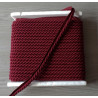 Upholstery piping cord 10mm - burgundy color, full reel, on grey background