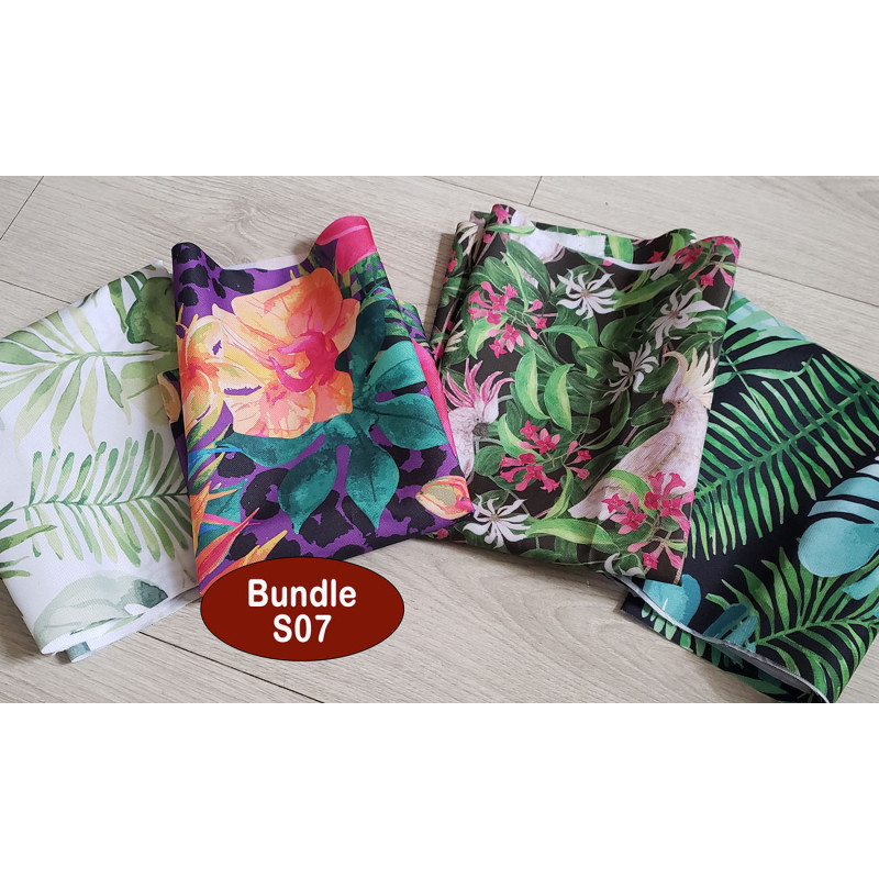 Outdoor fabric remnants bundle - 4 pieces- tropical designs placed on a white, wooden background