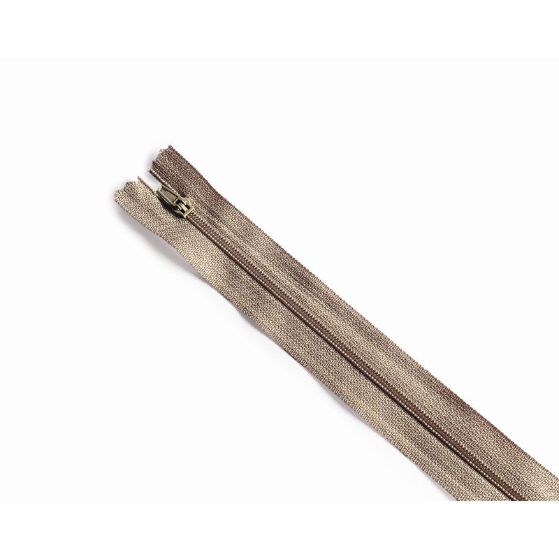 plastic coil zip size3 - beige - 45cm - closed end zip, placed across the frame on a white background plastic coil zip size3 - beige - 45cm - closed end zip, placed across the frame on a white background