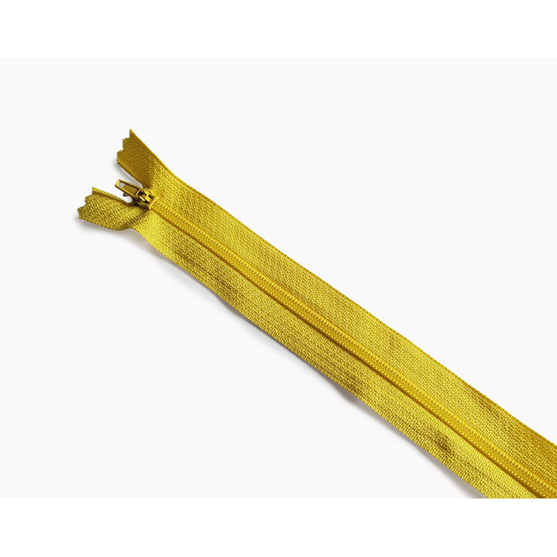 plastic coil zip size3 - yellow - 45cm - closed end zip, placed across the frame on a white background plastic coil zip size3 - yellow - 45cm - closed end zip, placed across the frame on a white background