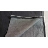 stretch denim fabric  - black color, placed on the table with the fold
