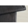 stretch denim fabric  - black color, placed on the table with the fold