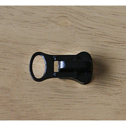 zip slider size 7 for  waterproof zip - black on a wooden background