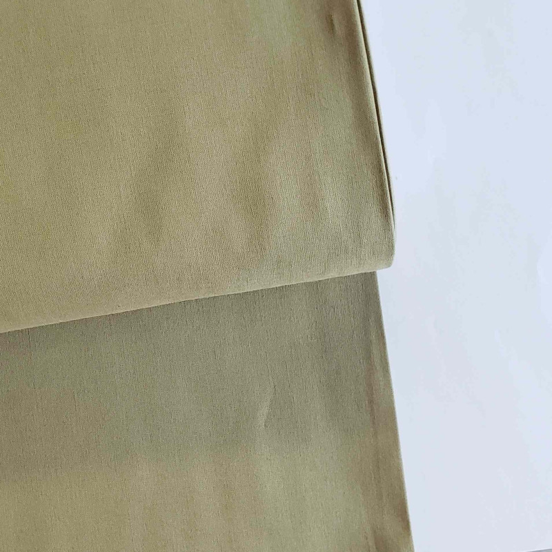 medium-weight cotton fabric -  khaki color, the fabric with the fold, placed across the frame