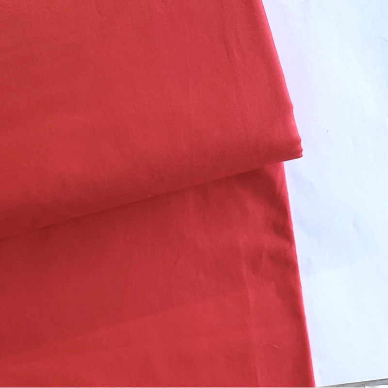 medium-weight cotton fabric - Poppy red- the fabric with the fold, placed across the frame