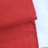 medium-weight cotton fabric - Poppy red- the fabric with the fold, placed across the frame