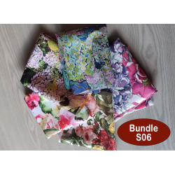 Water-resistant canvas fabric remnants bundle -floral designs mix- 5 pieces, placed on the table