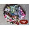 Water-resistant canvas fabric remnants bundle -floral designs mix- 5 pieces, placed on the table