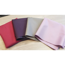 Waterresistant canvas fabric remnants bundle - mix of colors, placed on a wooden table