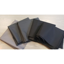 Waterresistant canvas fabric remnants bundle - mix of colors, placed on a wooden table