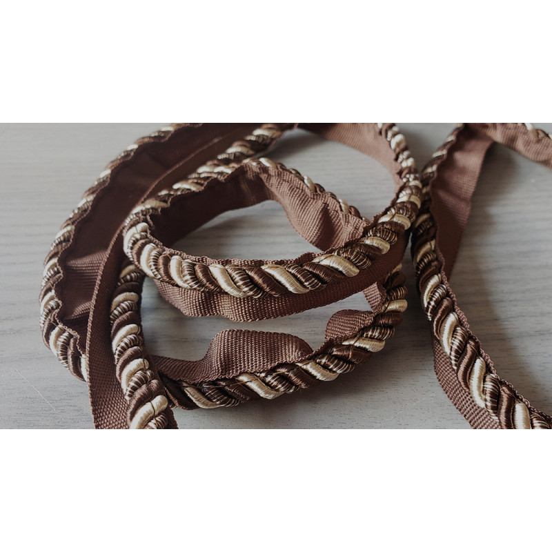 Two-tone upholstery piping cord - coffee brown/ beige - size 7, piping is placed on a wooden table