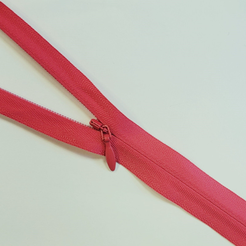 YKK closed-end invisible zip- Red - 65cm placed across the frame, on a white background