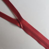YKK closed-end invisible zip- Burgundy - 65cm placed across the frame, on a white background
