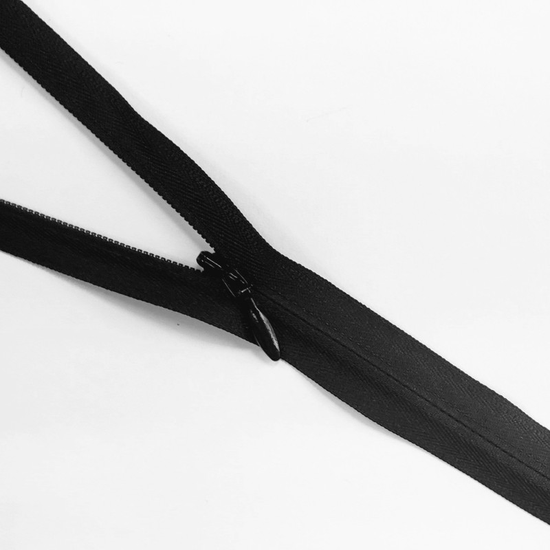YKK closed-end invisible zip- Black - 65cm placed across the frame, on a white background