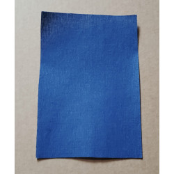 Iron-on  repair fabric in a royal blue color, placed on a beige background