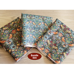 water-resistant fabric remnants bundle - W. Morris design, placed on a wooden table