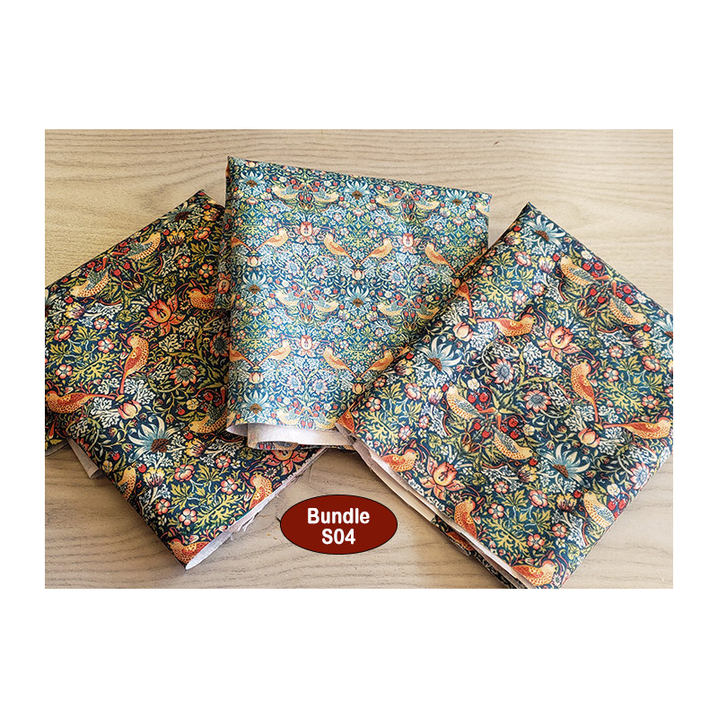 water-resistant fabric remnants bundle - W. Morris design, placed on a wooden table