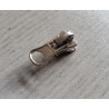 zip slider- chunky- size 3 - silver - short puller, plac3ed on a wooden table