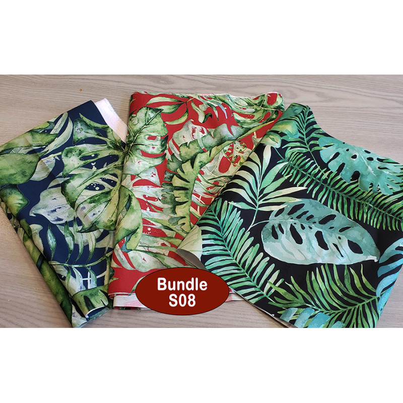 Outdoor fabric remnants bundle - tropical designs - 3 pieces, placed on a grey table