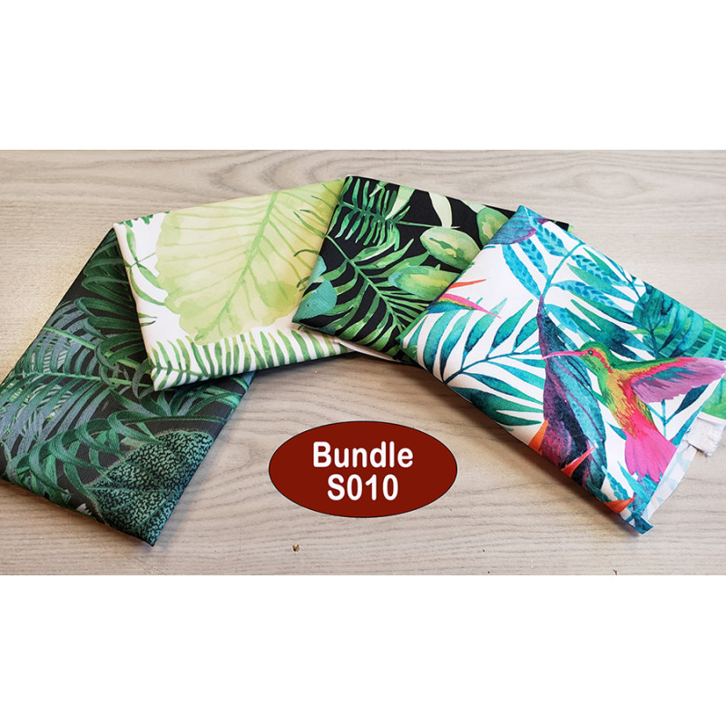 Outdoor fabric remnants bundle - 4 pieces - tropical designs, placed on a grey table